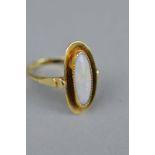AN EARLY MID 20TH CENTURY OPAL SINGLE STONE RING, opal measuring approximately 15mm x 6mm, bead