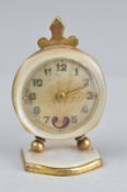 AN EARLY 20TH CENTURY LADIES DRESSING TABLE TIMEPIECE, the engine turned dial with cut out heart