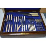 AN OAK CANTEEN OF CUTLERY, (one broken knife) (seventy pieces)