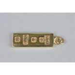 A 9CT GOLD INGOT PENDANT, approximate length 31mm, approximate weight 15.5 grams