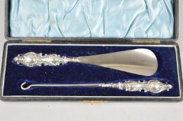 A CASED SILVER BUTTON HOOK AND SHOE HORN