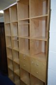 THREE IKEA STYLE BOOKCASES, one with four small drawers to centre