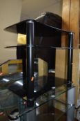 A BLACK GLASS T V STAND, a ewbank floor polisher and a sebo vacuum cleaner (3)
