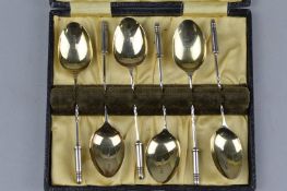 A CASED NOVELTY SET OF SIX SILVER SPOONS, with bullet finials, Birmingham 1926