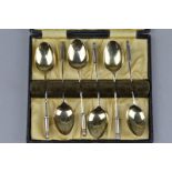 A CASED NOVELTY SET OF SIX SILVER SPOONS, with bullet finials, Birmingham 1926