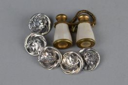 FIVE EARLY 20TH CENTURY WHITE METAL OPENWORK ART NOUVEAU BUTTONS, depicting a female head with