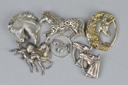 THREE SILVER HORSE BROOCHES, a silver horse pendant, Edinburgh 1972, Shetland Silver Craft, a silver