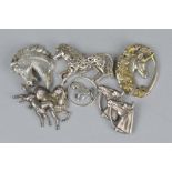 THREE SILVER HORSE BROOCHES, a silver horse pendant, Edinburgh 1972, Shetland Silver Craft, a silver