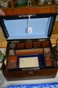 A WALNUT WORK BOX, fitted interior, two glass ink wells, (slight damage), and opening bottom drawer,