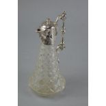 A PLATED TOPPED GLASS CLARET JUG