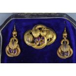 A VICTORIAN SUITE OF JEWELLERY, circa 1860, a pair of garnet ear pendants, textured and applied