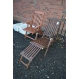 TWO FOLDING WOODEN GARDEN CHAIRS, one with leg rest