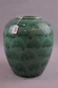 A POOLE POTTERY BULBOUS GREEN VASE, approximate height 28cm