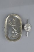 AN EDWARDIAN NOVELTY SILVER PIN TRAY, embossed with golfer and golf caddy, London 1902, Anglo