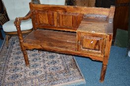 A HARDWOOD TELEPHONE SEAT, with a single cupboard