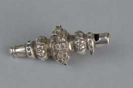 A LATE VICTORIAN SILVER RATTLE, with floral repousse decoration, whistle with suspension loop,
