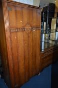 AN OAK WARDROBE, and dressing table, also a rustic pine bookcase and wicker linen box (4)