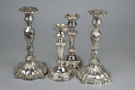 TWO PAIRS OF PLATED CANDLESTICKS