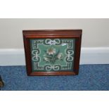 A VICTORIAN WOOL AND BEADWORK PANEL OF WHITE FLOWERS ON A GREEN GROUND, decorative border, glazed