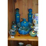 NINE PIECES OF MDINA GLASS TO INCLUDE TWO BLUE DECANTERS WITH STOPPERS, a 25cm diameter shallow bowl