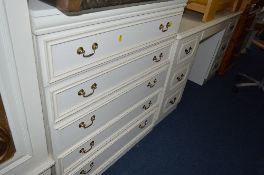 A MODERN DRESSING TABLE WITH SEVEN DRAWERS and a modern chest of five long drawers (2)