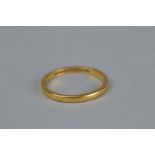 A 22CT YELLOW GOLD WEDDING BAND, width approximately 22mm, ring size O, approximate weight 2.6