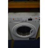 A HOTPOINT AQUARIUS WD0G 9640 WASHER DRYER (loose latch on door)