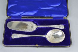 A PAIR OF CASED PLATED SERVERS