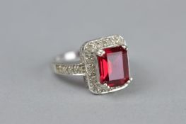 A SYNTHETIC RUBY AND WHITE STONE RECTANGULAR 9CT WHITE GOLD CLUSTER RING, ring size N, approximate