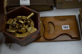 A REPRODUCTION BRASS SEXTANT IN A HEXAGONAL CASE, with an oak bookslide (2)