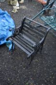 A CAST METAL GARDEN SEAT, with ornamental bench ends, approximate width 67cm