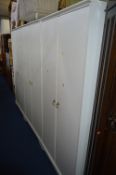 THREE WHITE MODERN TWO DOOR WARDROBES, and three corrigated storage boxes (6)