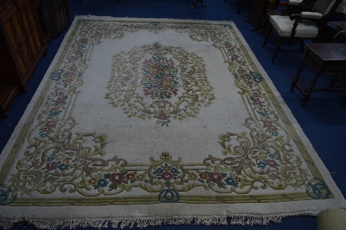 A KAYAM CHINESE WOOL RUG, cream ground and flower decoration, approximate size 370cm x 274cm and - Image 2 of 2