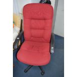 AN OFFICE SWIVEL CHAIR