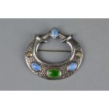 A MID 20TH CENTURY SILVER ENAMELLED BROOCH, the raised oval, circular and hexagonal beige, green and