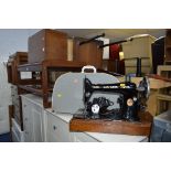 A CASED SINGER SEWING MACHINE and another sewing machine (2)