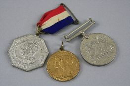 A WWII DEFENCE MEDAL, (no ribbon), together with a Middlesex County Council silver coloured