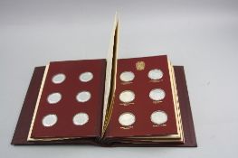 AN ALBUM OF 24 STERLING SILVER MEDALS, Winston Churchill birth to death, housed in a presentation