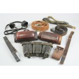 A PLASTIC BOX CONTAINING VARIOUS ITEMS OF LEATHER WEBBING, AMMUMITION POUCHES, BELTS, etc, also a