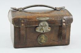 A BROWN LEATHER RECTANGULAR POSSIBLY VICTORIAN AMMUNITION BOX, of metal inner, with metal clasp