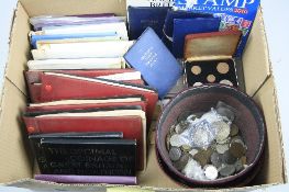 A BOX CONTAINING YEAR SETS, 1970-1980 Royal Mint, two Fez Hat containing World coins with amounts of