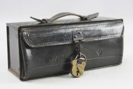 A BLACK LEATHER AND METAL AMMUNITION BOX, dated 1942 'V' mark, also metal inside with Asp/staple