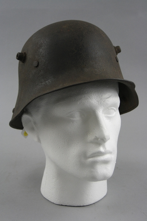 A GERMAN WWI ERA STANHELM STYLE ARMY METAL HELMET, the helmet is slightly rusted, but in overall