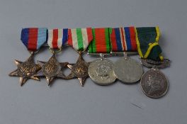 A GROUP OF WWII MEDALS, on a wearing bar, consisting 1939-45, France and Germany, Italy Stars,