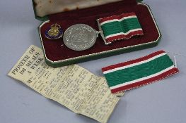 A BOXED WOMENS VOLUNTARY SERVICE MEDAL, un-named, together with small press cutting relating to