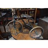 AN EARLY 20TH CENTURY CHILD'S TRICYCLE, the leather saddle stamped The Fairy Cycle