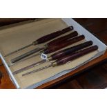 A TRAY CONTAINING FIVE VINTAGE HAND CHISELS, including a Record power chisel