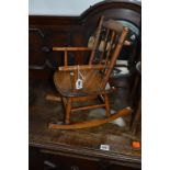 A MAHOGANY MINIATURE ROCKING CHAIR