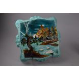 A LATE VICTORIAN MAJOLICA TUBE LINED SQUARE STAND, swans on river scene, painted 699/51 to base,
