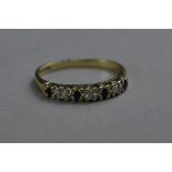 A MODERN 9CT GOLD SAPPHIRE AND DIAMOND ETERNITY RING, ring size M, hallmarked 9ct gold,